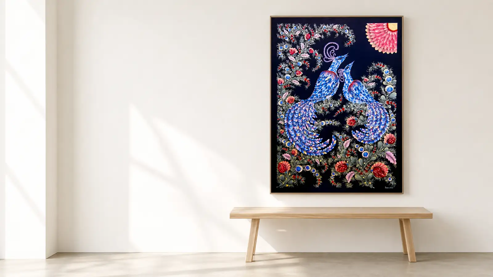 The piece on a bright wall above a wooden bench